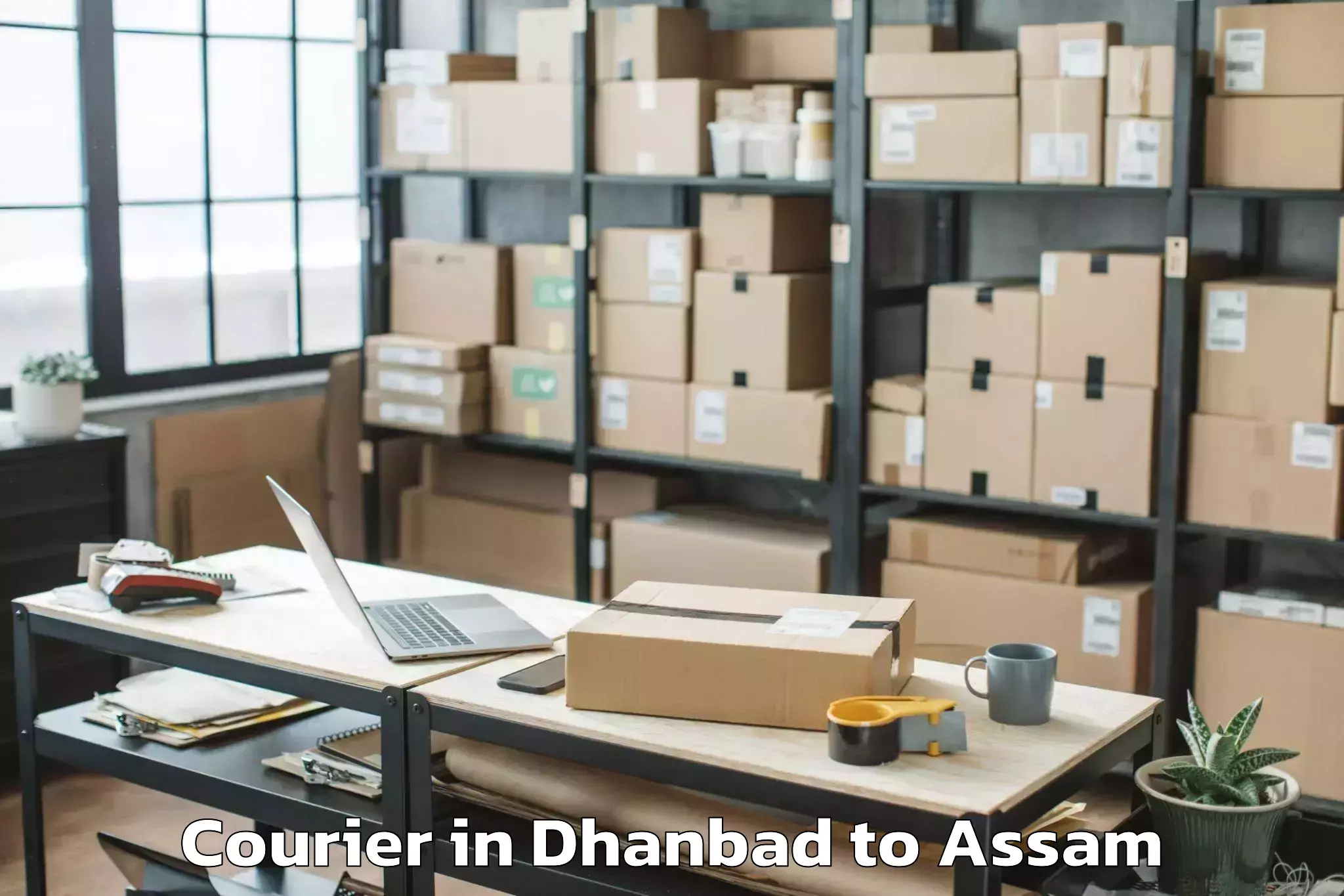 Trusted Dhanbad to Basugaon Courier